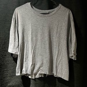 Lululemon greyish/blueish tint crop t-shirt with open back.